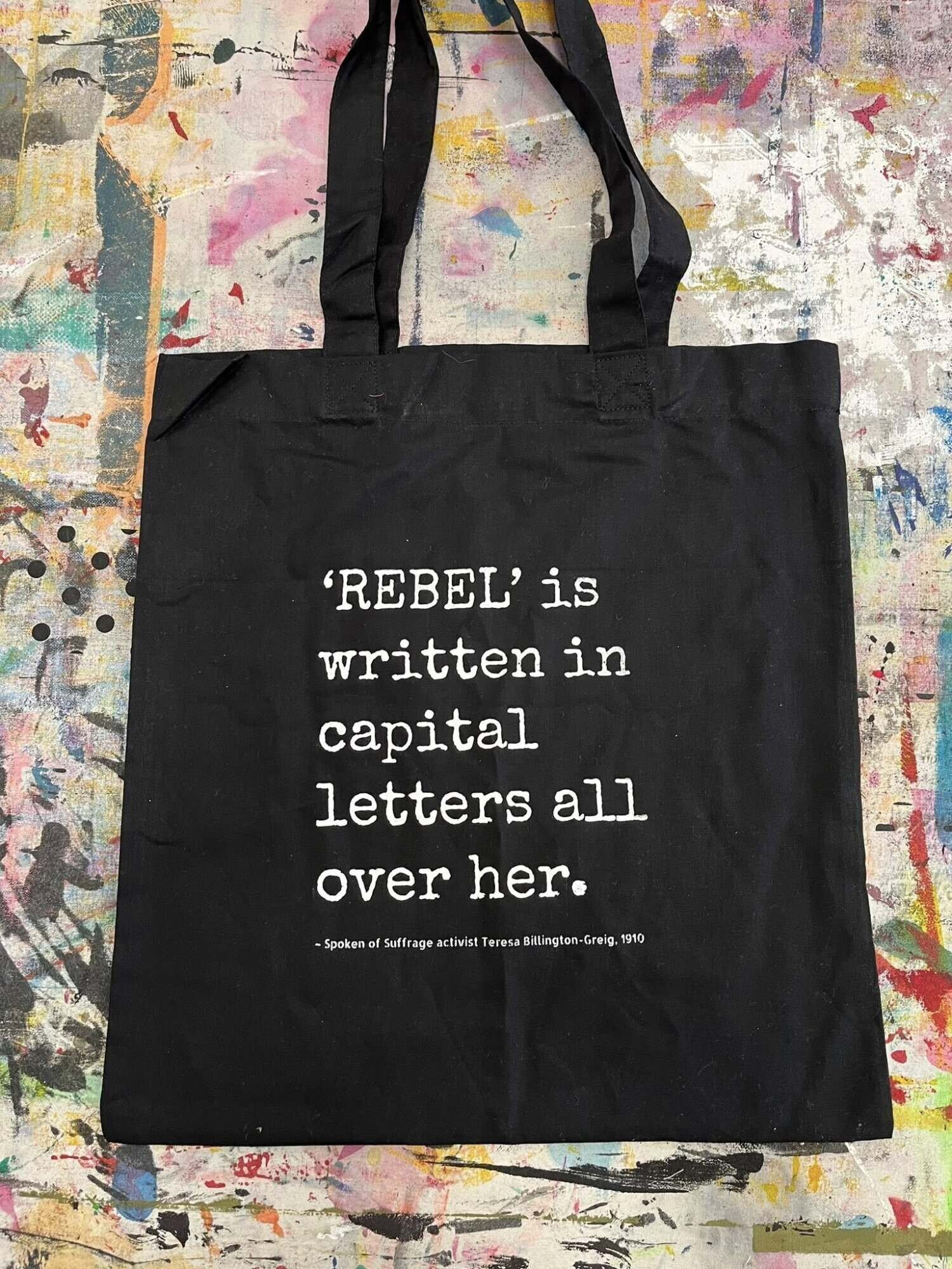 Tote bag with the word REBEL written all over it.
